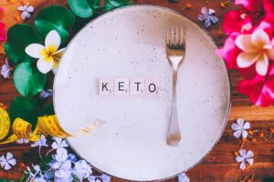 Keto diet and Silver fork lying on a plate