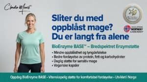 Claudia Münch smilende kvinne med grønn t-skjorte foran informasjonsplakat om oppblåst mage.